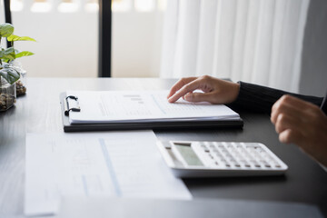 business man Auditor or internal revenue service staff checking annual financial statements company...