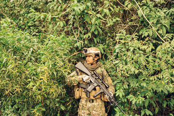 The forest path ahead seems calm, but the soldier knows better; years of combat experience have taught him that danger often lies just beyond what the eyes can see.
