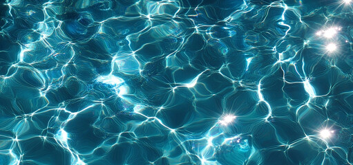 Abstract patterns in turquoise blue water with shimmering sun reflections