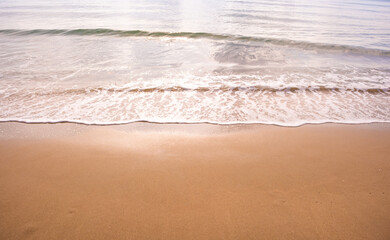 Nature of the beach and sea Summer with sunshine, sandy beaches, clear blue waters sparkling against the blue sky. On an island with good ecology and environment Background for summer vacation
