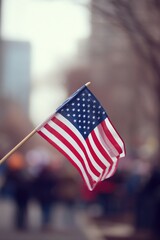 united states flag gently waves in breeze its vibrant colors contrasting with blurred backdrop of people in motion