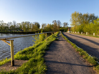 A paved path next to a body of water