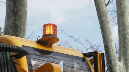 Flashing light on yellow vehicle signals road work