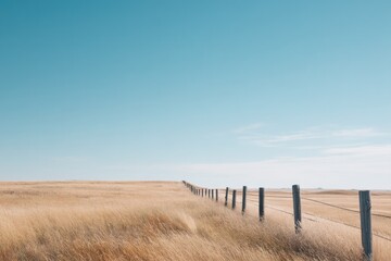 tranquil rural scene with lone wooden fence under vast sky