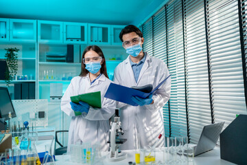 Portrait of Asian scientists work together in the research laboratory. 