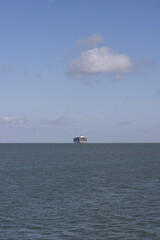A large container ship leaves the port and heads out to sea. Globalization, supply chain, tariff...