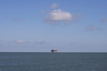 A large container ship leaves the port and heads out to sea. Globalization, supply chain, tariff...