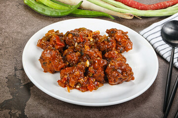 Manchurian chicken with sauce and spices