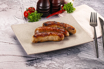 Delicous natural roasted sausages in the plate