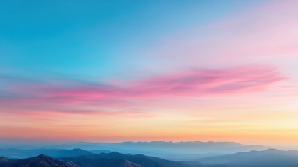 Fototapeta premium Pastel twilight sky above mountain ridge with soft clouds creating serene atmosphere
