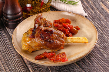 Baked lamb shank with vegetables