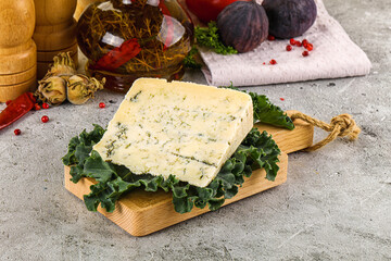 Blue cheese piece over board