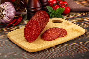 Spicy pepperoni sausages with sliced piece