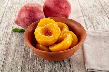 Sweet ripe yellow canned peaches