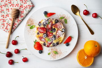 French clafoutis tart with red berries. Top view.