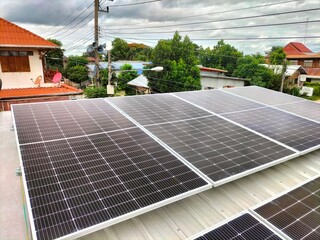 Installing solar panels on the roof to use as alternative energy for electricity.