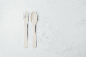 Eco-friendly utensils on a neutral background in natural lighting