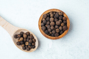 Unique spices in wooden bowl and spoon ready for culinary use