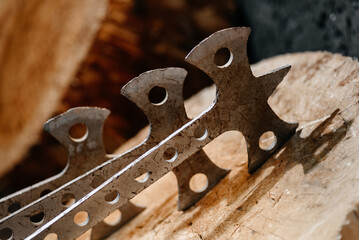three metal axes in wooden stump as target, throwing axes and knives, sports competition, selective...