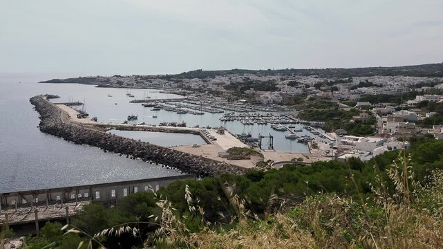 Santa Maria di Leuca, located at the tip of Italy's "heel" (aka the Salento peninsula), is shown in a wide view during a summer day.