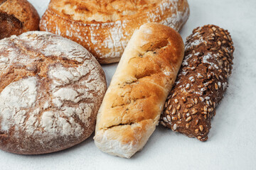 Freshly baked artisanal bread assortment on a light surface