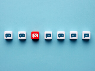 Censorship and free speech concept. Speech bubbles on cubes with one of them is banned.