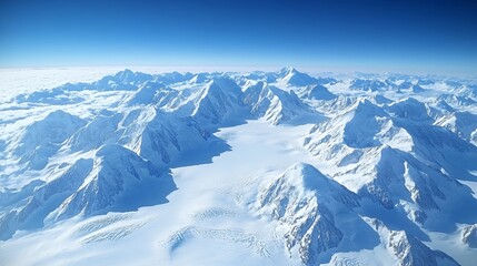 Fototapeta premium Majestic snow-covered mountains under a clear blue sky from above.