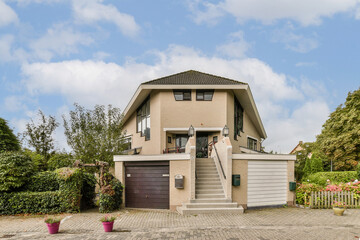 A contemporary two-story house featuring a stylish facade, surrounded by greenery and well-maintained gardens, showcasing modern architecture and design.