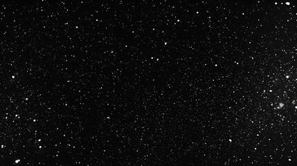 Fototapeta premium A black and white photo of a starry night sky