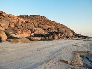 Shell coast of the Caspian Sea. Road along the sea.