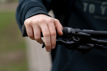 Child's hand mistakenly pressing on a bicycle handbrake lever