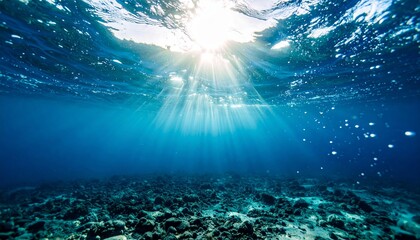 Fototapeta premium Underwater Ocean Scene Sunbeams Shining Through Water Surface Seabed
