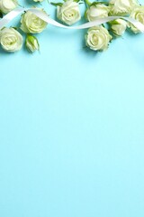 Beautiful white roses on color background