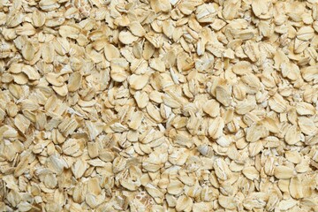 Oatmeal flakes as a background. Cooking breakfast