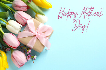 Happy Mother's day. Beautiful bouquet of fresh tulips on a colored background