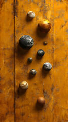 Orbs of various textures and colors placed on a vibrant ochre background creating depth and visual interest