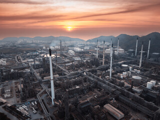 Aerial view oil refinery and fuel storage tanks at industrail estate area on island.