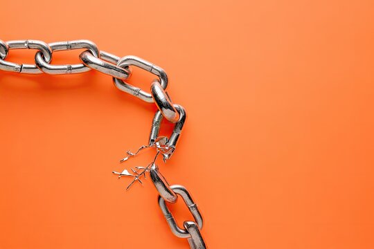 Broken chain on orange background (1)