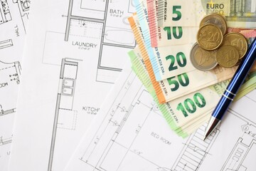 European union Euro money bills and coins with construction project blueprints on table