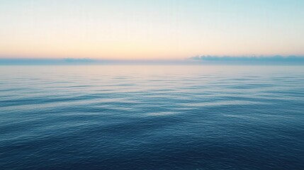 Obraz premium Tranquil ocean expanse at dawn.