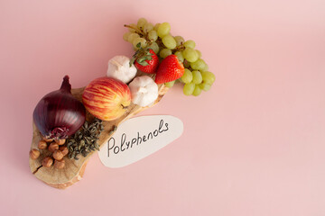 Products containing polyphenols in their composition. Grapes, onions, garlic, chocolate, tea, close-up on a light background