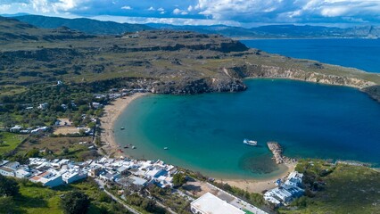 Obraz premium Lindos Beach Megali Paralia, the large and sandy beach of Lindos is one of the most beautiful beaches on the Rhodes island.