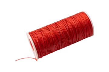 Close up of a vibrant spool of red thread with white ends transparent background