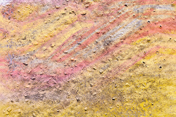 colored background, photo of a building wall with lines and strokes of pink, purple, yellow and blue paint
