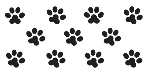 Fototapeta premium Set of black paw prints animal tracks on a white background