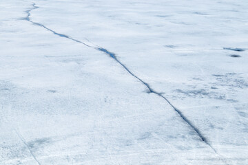 cracks on the melting sea ice surface
