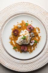 Yogurt ice cream with cherry and cookie. Top view table.