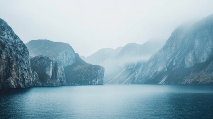 Naklejka premium Misty mountains with rugged cliffs and a calm lake on white background.