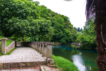 Fototapeta premium Lake in the mountains near the New Athos, Abkhazia, spring 2023