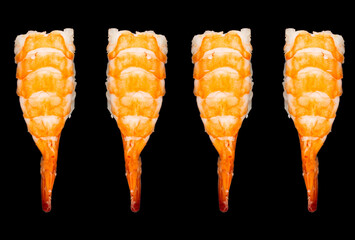 Top view Shrimp nigiri sushi isolated on black background. Black tiger prawn sushi isolated.